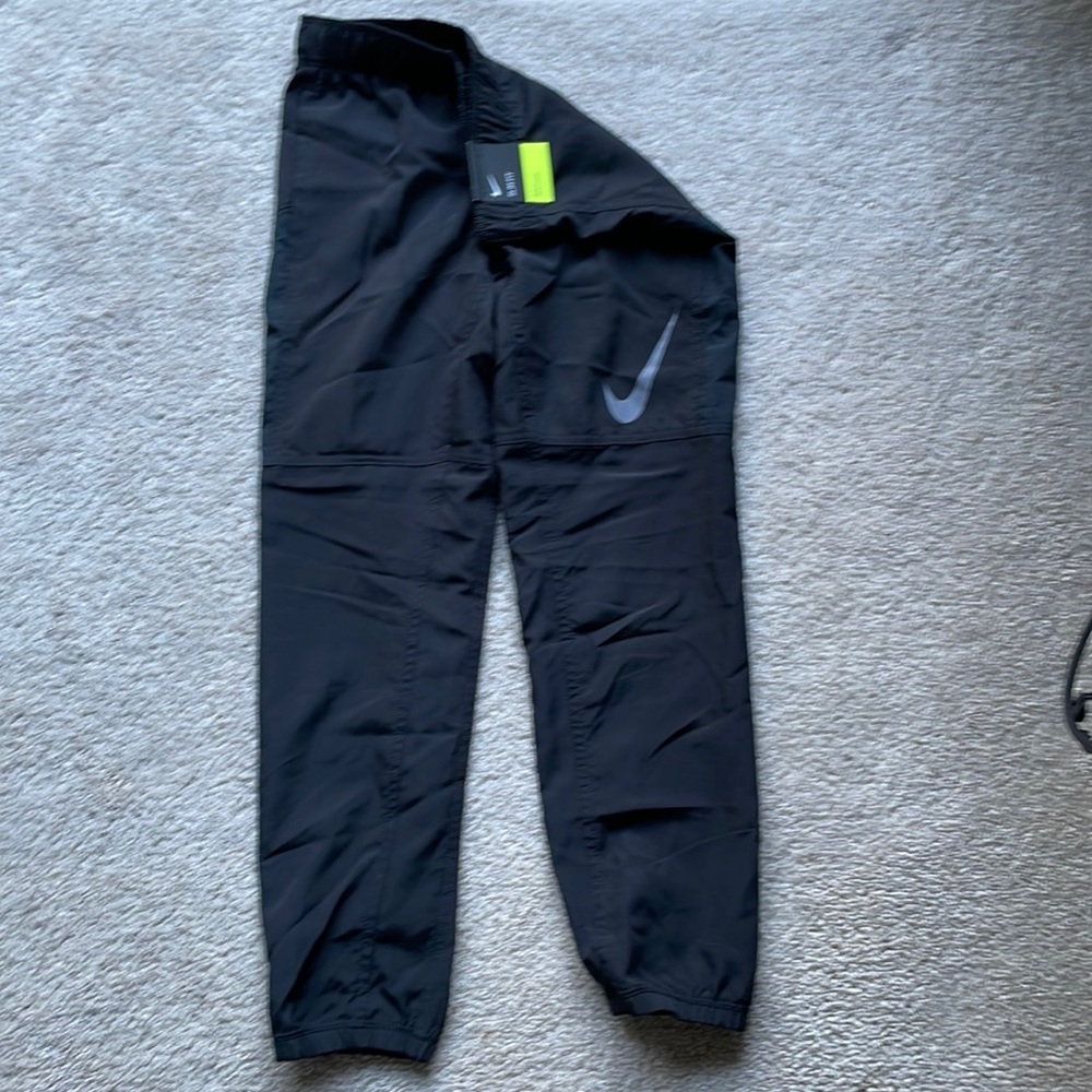 NWT Nike windpants. Size small. Black.